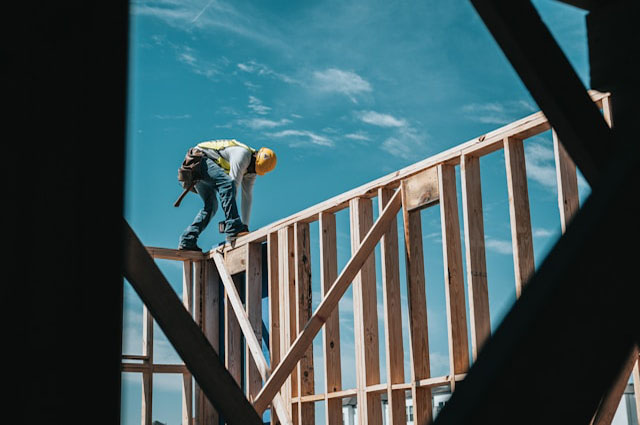 worker wearing hard hat while framing
